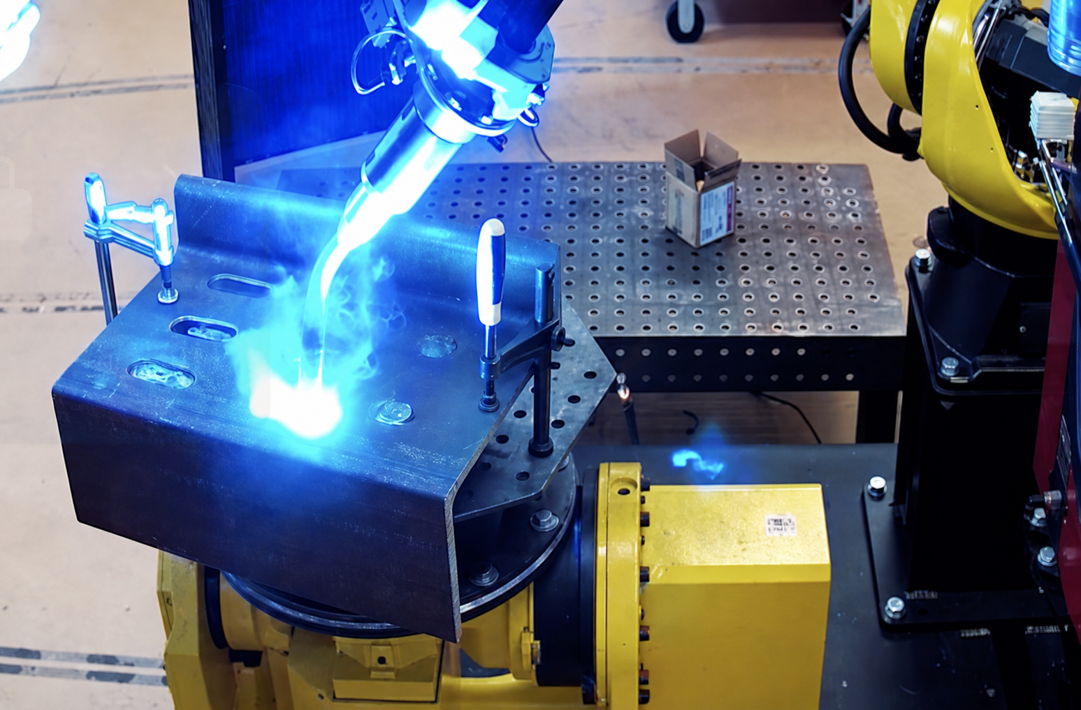Robot welding a bent plate bracket
